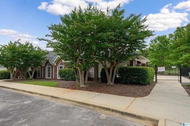 254 Macdonald Lake Rd, Springville, AL 35146 - obstructed view of property with fence, a gate, and brick siding