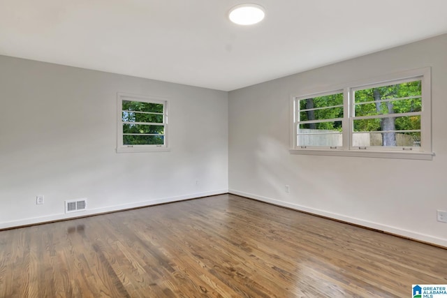 1324 Laurence St, Irondale, AL 35210 - spare room featuring baseboards and wood finished floors