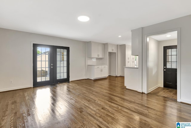 1324 Laurence St, Irondale, AL 35210 - unfurnished living room with dark wood-style floors, baseboards, and recessed lighting