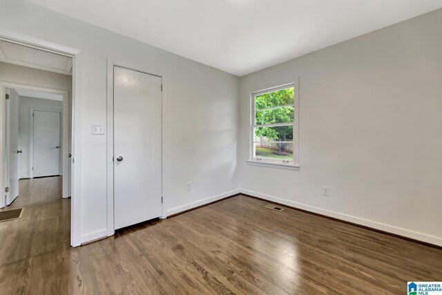 1324 Laurence St, Irondale, AL 35210 - unfurnished bedroom featuring wood finished floors and baseboards