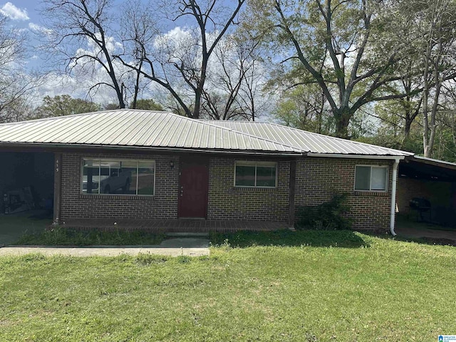 415 Thomas St, Warrior, AL 35180 - ranch-style house with an attached carport, brick siding, and metal roof