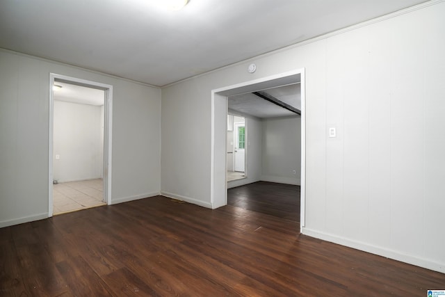 415 Thomas St, Warrior, AL 35180 - empty room featuring wood finished floors, baseboards, and a smoke detector