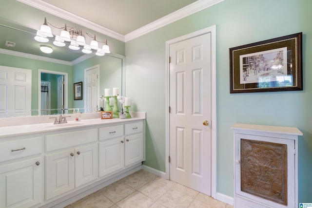 bathroom with ornamental molding, tile patterned flooring, vanity, and baseboards