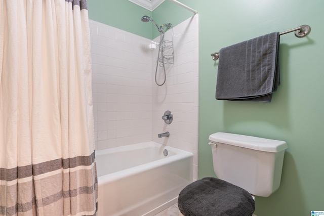 bathroom with shower / tub combo and toilet