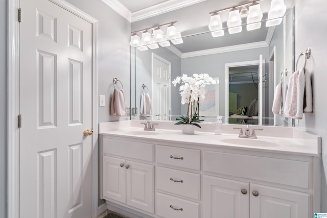 bathroom with double vanity and crown molding