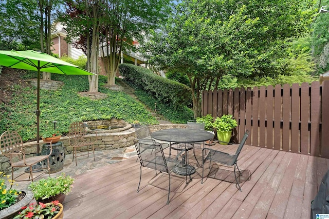 wooden deck featuring outdoor dining area