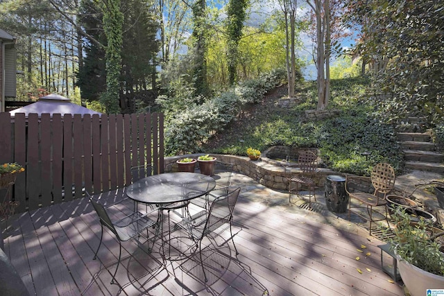 wooden terrace with outdoor dining space