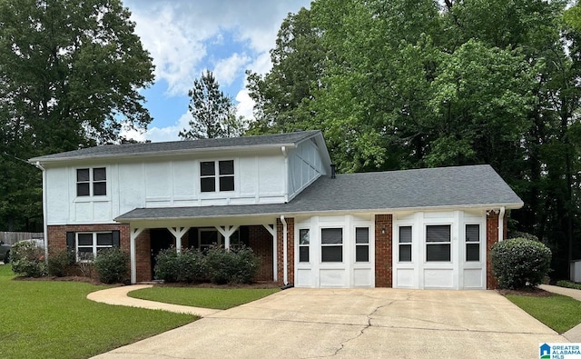 1829 Creely Dr, Birmingham, AL 35235 - view of front of property with brick siding, concrete driveway, a front yard, a garage, and stucco siding