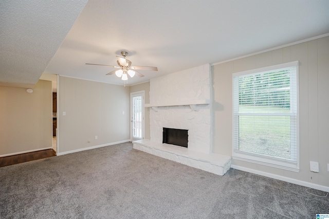 1829 Creely Dr, Birmingham, AL 35235 - unfurnished living room featuring carpet, a ceiling fan, a stone fireplace, and baseboards