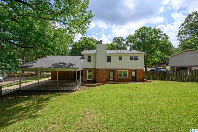 1829 Creely Dr, Birmingham, AL 35235 - back of property with a carport, brick siding, and a chimney