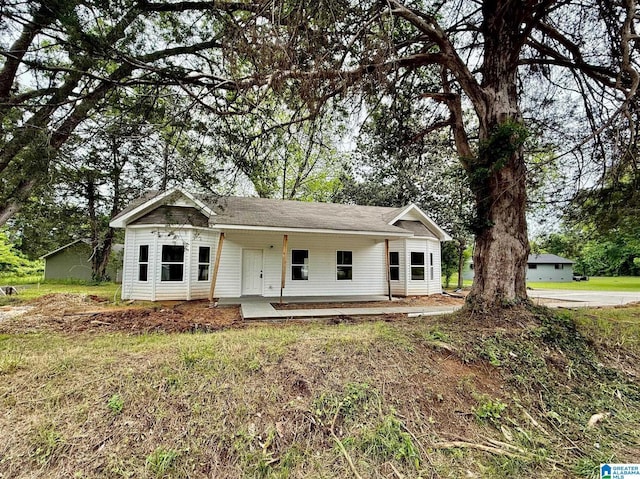 7209 Pamela St, Leeds, AL 35094 - view of front facade featuring covered porch and roof with shingles
