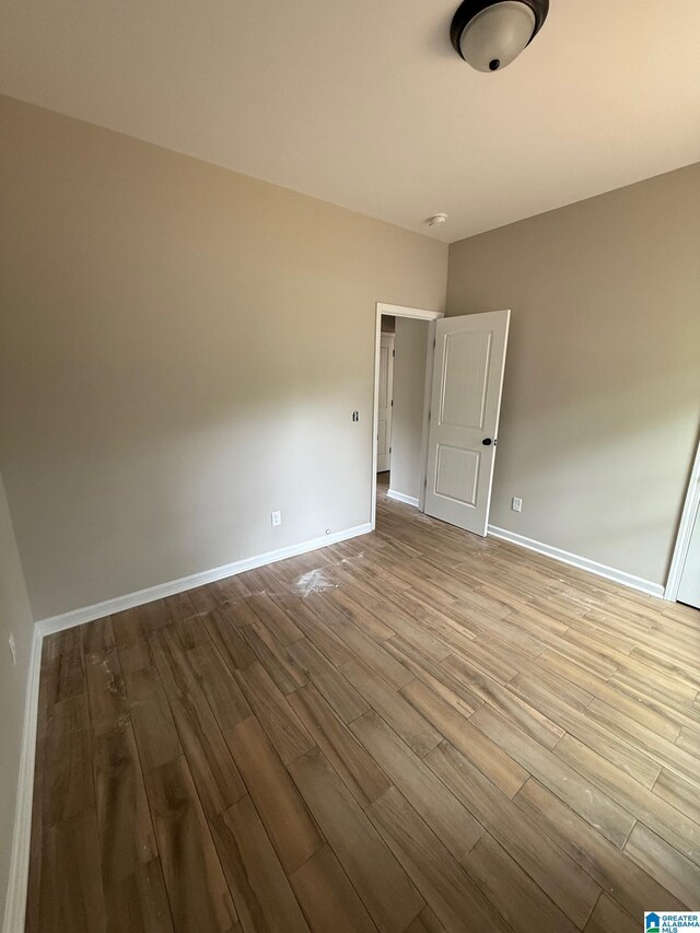 7209 Pamela St, Leeds, AL 35094 - empty room featuring wood finished floors and baseboards