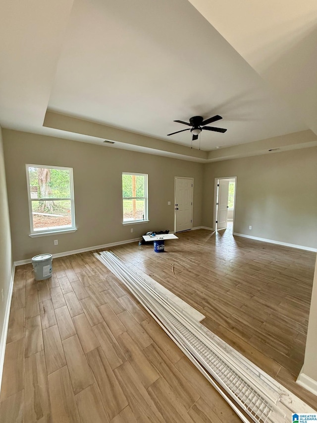 7209 Pamela St, Leeds, AL 35094 - empty room with plenty of natural light, light wood-style flooring, baseboards, and ceiling fan