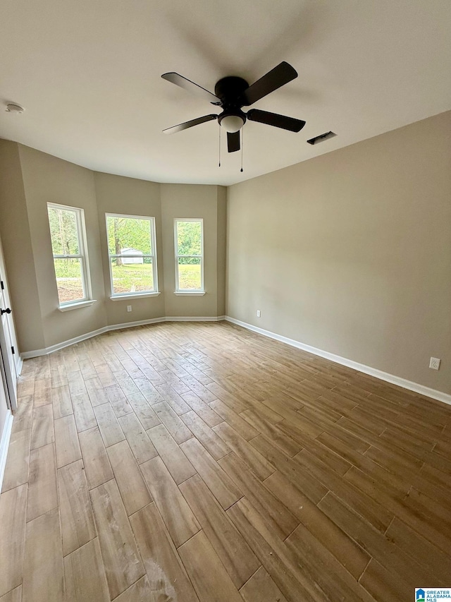 7209 Pamela St, Leeds, AL 35094 - spare room with a ceiling fan, wood finished floors, baseboards, and a smoke detector