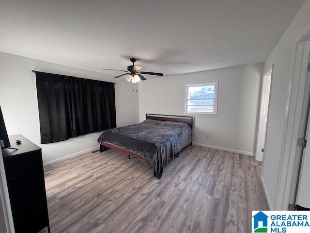 3585 County Road 26, Wadley, AL 36276 - bedroom featuring wood finished floors, baseboards, and ceiling fan