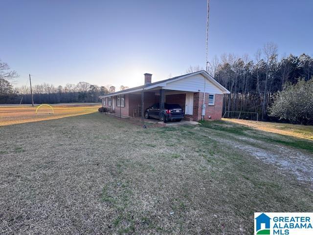 3585 County Road 26, Wadley, AL 36276 - view of outdoor structure with an attached carport and driveway