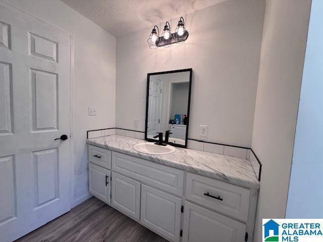 3585 County Road 26, Wadley, AL 36276 - bathroom featuring vanity and wood finished floors