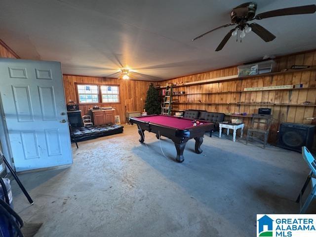 3585 County Road 26, Wadley, AL 36276 - game room featuring wood walls, billiards table, a ceiling fan, and unfinished concrete floors