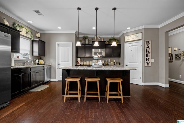 300 Braddock Rd W, Springville, AL 35146 - kitchen featuring appliances with stainless steel finishes, baseboards, a kitchen breakfast bar, light stone countertops, and dark wood-style flooring