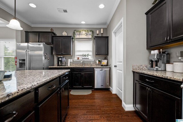 300 Braddock Rd W, Springville, AL 35146 - kitchen with appliances with stainless steel finishes, dark wood finished floors, recessed lighting, light stone countertops, and ornamental molding
