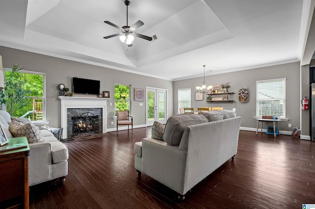 300 Braddock Rd W, Springville, AL 35146 - living area featuring a raised ceiling, a fireplace, a ceiling fan, plenty of natural light, and crown molding