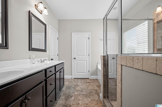 300 Braddock Rd W, Springville, AL 35146 - bathroom featuring a stall shower, double vanity, a garden tub, and baseboards