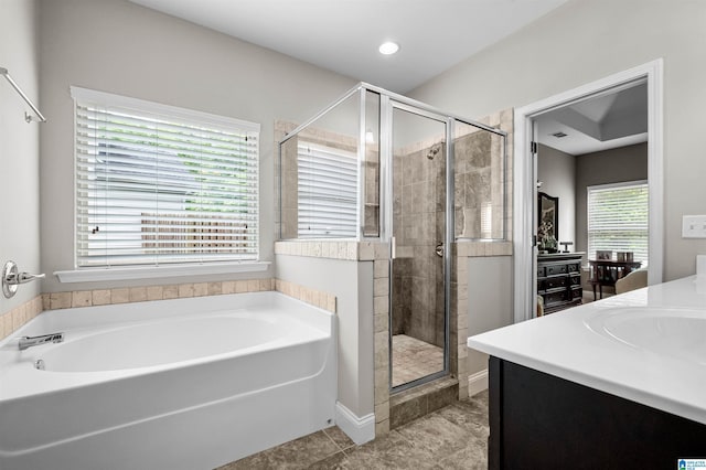 300 Braddock Rd W, Springville, AL 35146 - full bath featuring a stall shower, a garden tub, vanity, tile patterned floors, and recessed lighting