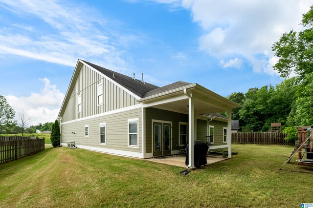 300 Braddock Rd W, Springville, AL 35146 - back of house with board and batten siding, a patio, and roof with shingles