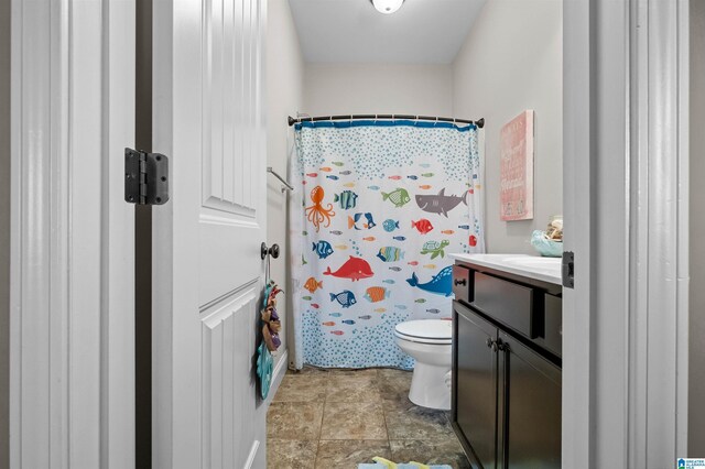 300 Braddock Rd W, Springville, AL 35146 - full bath featuring toilet, vanity, and a shower with shower curtain