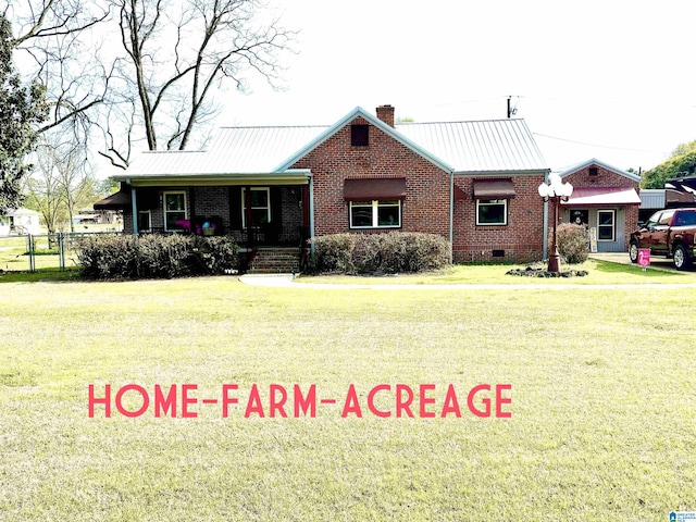 1080 Garmon Rd, Gadsden, AL 35901 - ranch-style house featuring a chimney, a front lawn, brick siding, and metal roof