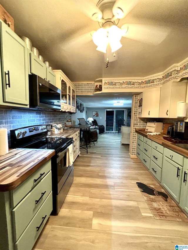 1080 Garmon Rd, Gadsden, AL 35901 - kitchen featuring butcher block countertops, green cabinetry, stainless steel appliances, a ceiling fan, and light wood finished floors