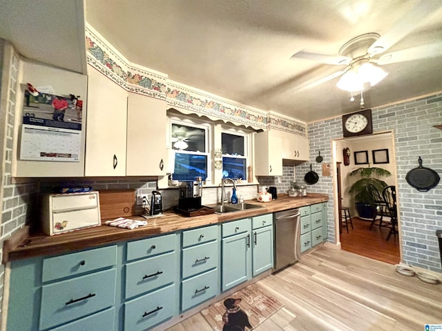 1080 Garmon Rd, Gadsden, AL 35901 - kitchen with butcher block counters, stainless steel dishwasher, a sink, ceiling fan, and brick wall