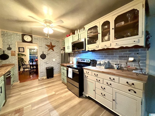 1080 Garmon Rd, Gadsden, AL 35901 - kitchen with appliances with stainless steel finishes, butcher block countertops, ceiling fan, and light wood finished floors