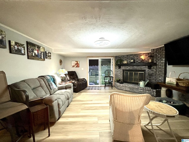 1080 Garmon Rd, Gadsden, AL 35901 - living area with a textured ceiling, light wood-style flooring, and a fireplace