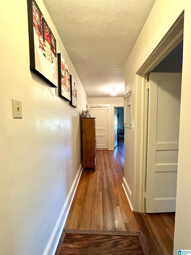 1080 Garmon Rd, Gadsden, AL 35901 - hall with hardwood / wood-style floors, baseboards, and a textured ceiling