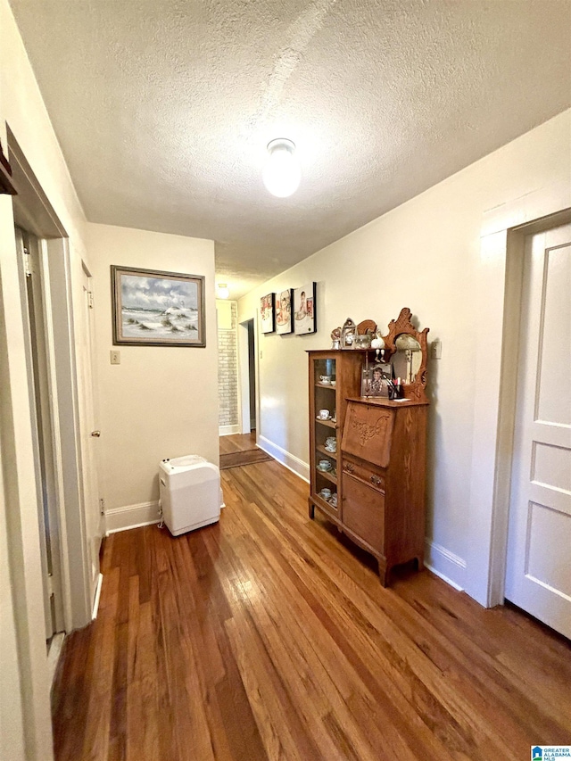 1080 Garmon Rd, Gadsden, AL 35901 - corridor with wood finished floors, baseboards, and a textured ceiling