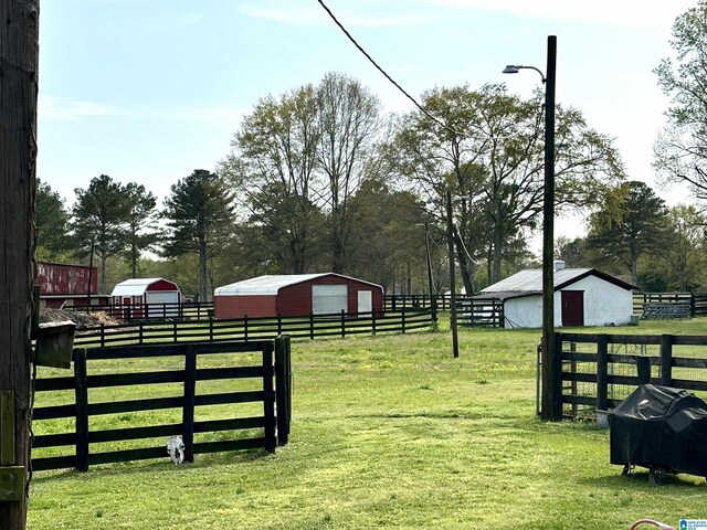 1080 Garmon Rd, Gadsden, AL 35901 - view of yard featuring a pole building, an outbuilding, a detached garage, and an exterior structure