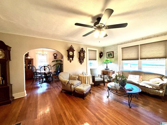 1080 Garmon Rd, Gadsden, AL 35901 - living area featuring arched walkways, a ceiling fan, a chandelier, and wood finished floors