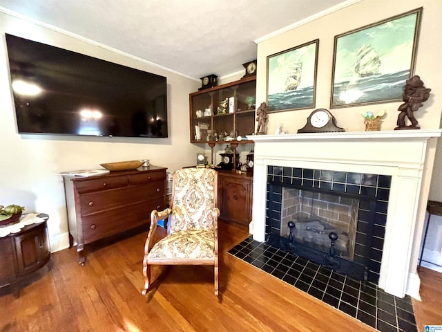 1080 Garmon Rd, Gadsden, AL 35901 - sitting room featuring wood finished floors, ornamental molding, a fireplace, and baseboards