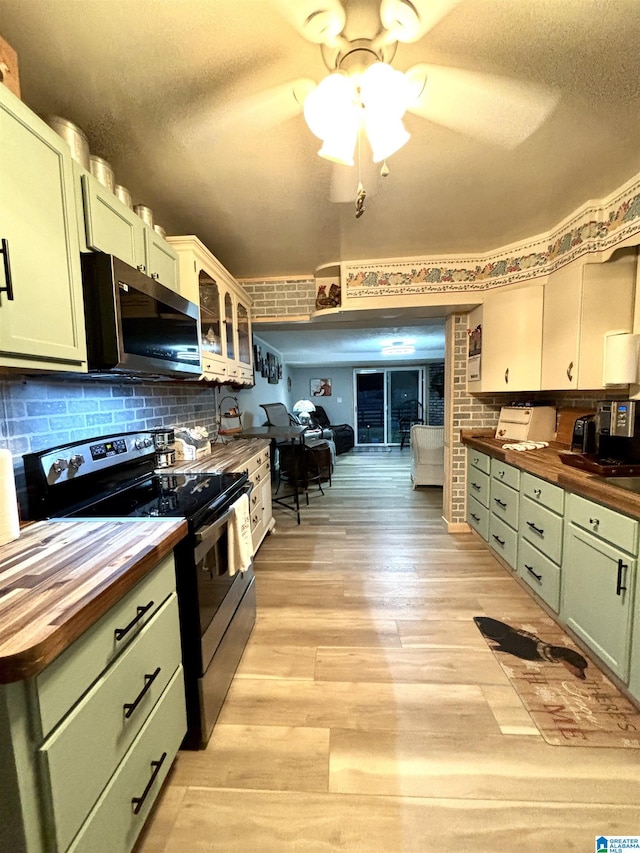 1080 Garmon Rd, Gadsden, AL 35901 - kitchen featuring wooden counters, stainless steel appliances, green cabinets, light wood-style flooring, and a textured ceiling