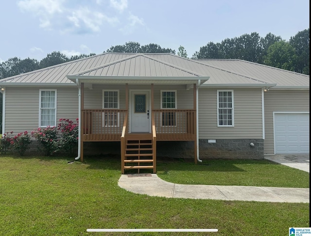 201 Hidden Meadows Dr, Hayden, AL 35079 - view of front facade with a garage, a front yard, a porch, and metal roof