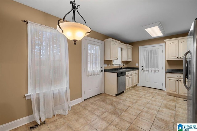 201 Hidden Meadows Dr, Hayden, AL 35079 - kitchen featuring appliances with stainless steel finishes, a sink, dark countertops, and pendant lighting