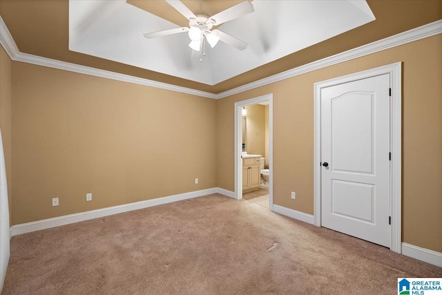 201 Hidden Meadows Dr, Hayden, AL 35079 - unfurnished bedroom with light colored carpet, baseboards, a raised ceiling, connected bathroom, and ornamental molding
