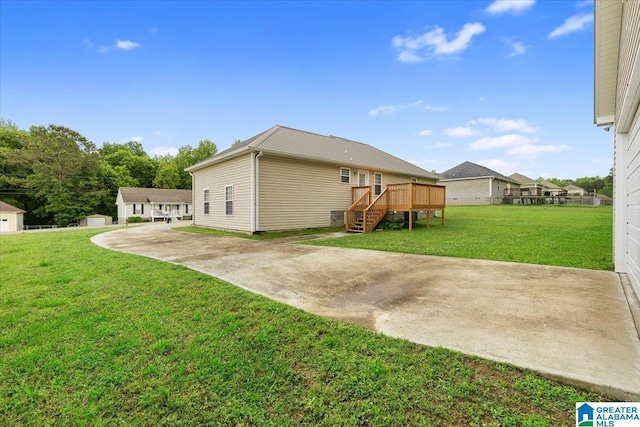 201 Hidden Meadows Dr, Hayden, AL 35079 - rear view of house with a wooden deck and a lawn