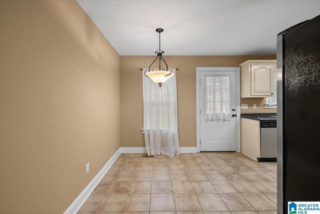 201 Hidden Meadows Dr, Hayden, AL 35079 - kitchen with stainless steel appliances, white cabinetry, dark countertops, pendant lighting, and baseboards