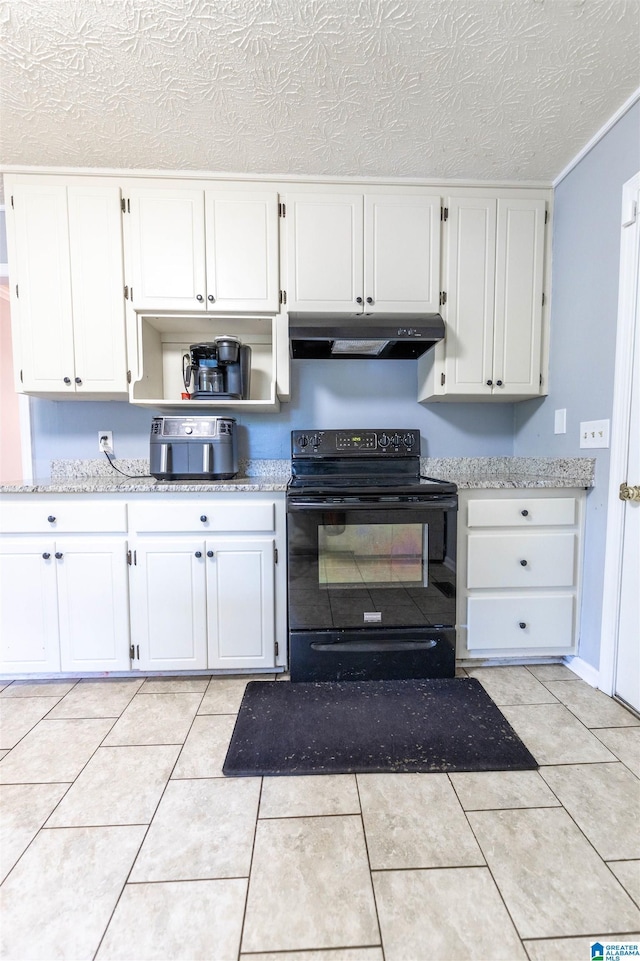 1201 Devonshire Dr NE, Jacksonville, AL 36265 - kitchen featuring black electric range, under cabinet range hood, white cabinetry, a textured ceiling, and light tile patterned flooring