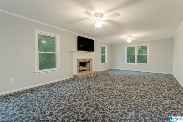 1201 Devonshire Dr NE, Jacksonville, AL 36265 - unfurnished living room with carpet, a ceiling fan, baseboards, crown molding, and a brick fireplace