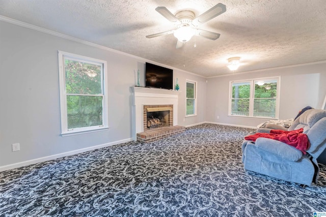 1201 Devonshire Dr NE, Jacksonville, AL 36265 - carpeted living room featuring a textured ceiling, ornamental molding, healthy amount of natural light, a fireplace, and ceiling fan