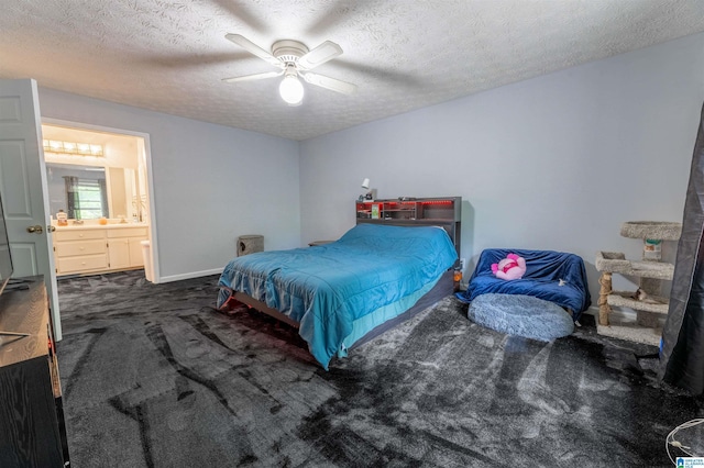 1201 Devonshire Dr NE, Jacksonville, AL 36265 - bedroom featuring carpet flooring, a textured ceiling, ensuite bathroom, ceiling fan, and baseboards