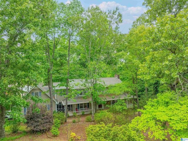 1201 Devonshire Dr NE, Jacksonville, AL 36265 - back of property with covered porch and a chimney